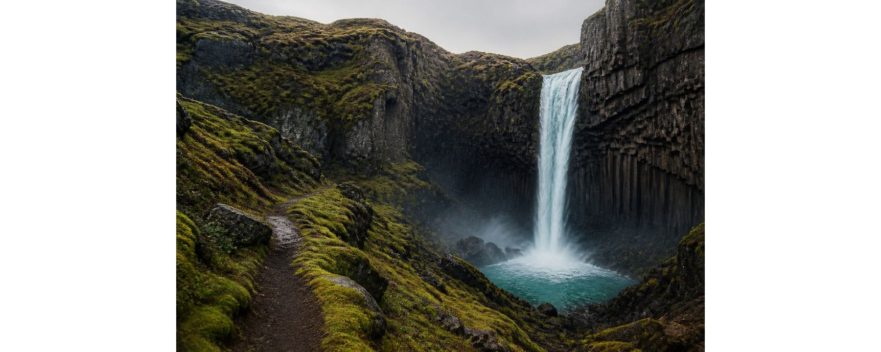 Moss-covered Icelandic canyon with a secluded waterfall